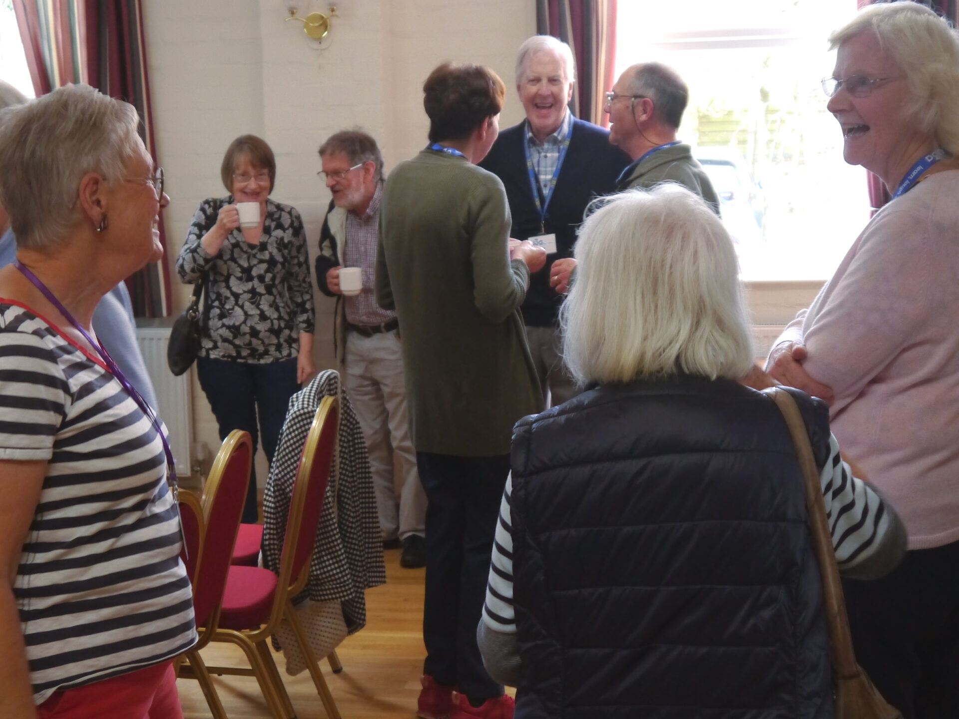 Members gathered and smiling at a Core Meeting
