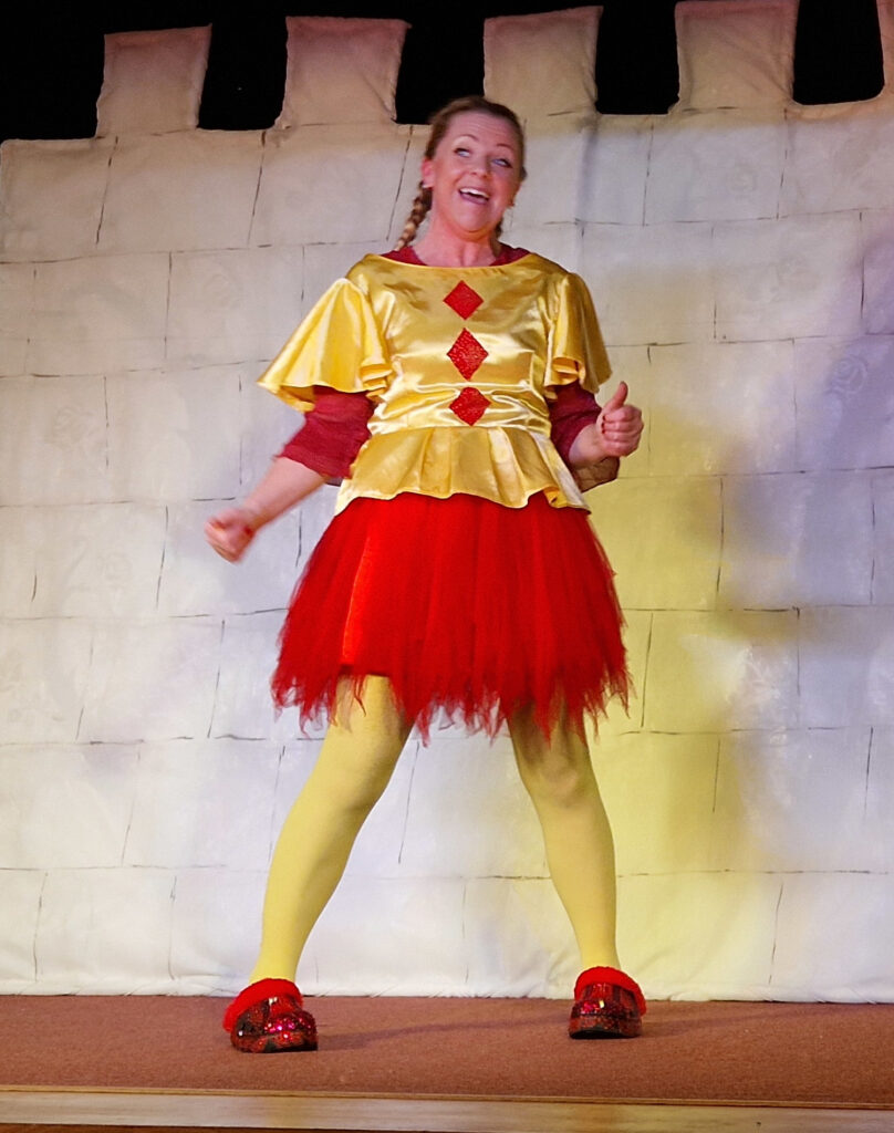 Jennifer Stone ("Auntie Jen") performing as the Court Jester in her "Sleeping Beauty" pantomime, December 2025